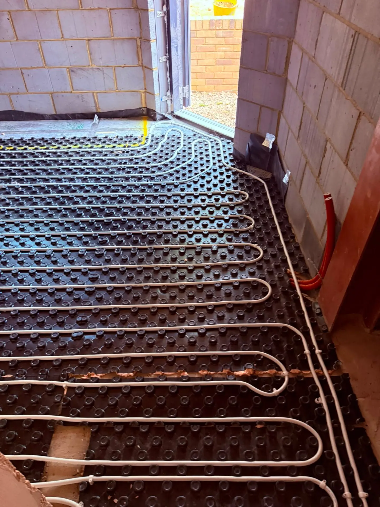 Underfloor heating pipework laid over insulation panels, Oxfordshire