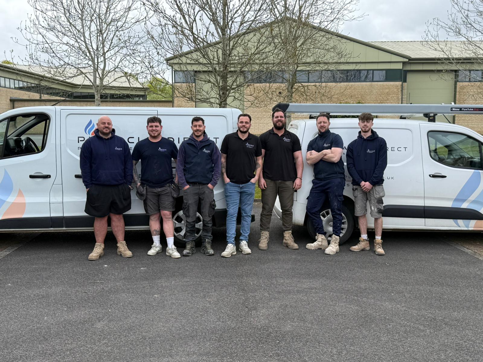 The Pinnacle Plumbing & Heating team with company vans in Oxfordshire